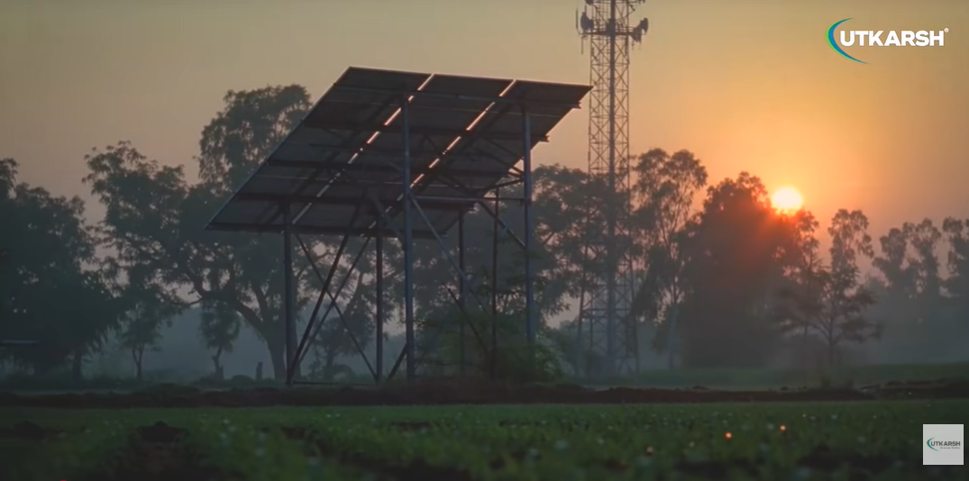 Solar panels capturing sunlight across a green landscape